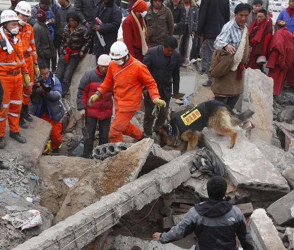 Rescuers work in a sustaining operation of searching for survivors among debris in quake-hit Yushu County, Qinghai Province, April 16, 2010. A dragnet serach for survivors is implemented throughly at all rescuing sites as the 'golden 72 hours', a key surviving chance for buried people comes on Friday. Yushu was jolted by a 7.1-magnitude earthquake Wednesday morning, which has left at least 1,144 people dead.