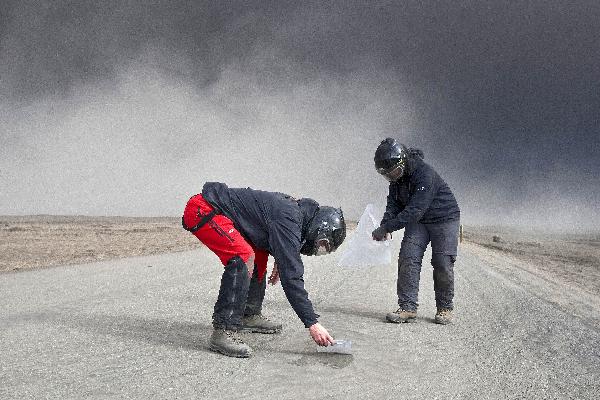 Volcanic scientists collect samples of ash to send to labs to analyze its content, in eastern Iceland. Scientists said the Eyjafjallajokull eruption couldhave a regional effect on Europe's climate -- but only provided it went on for a matter of years. 