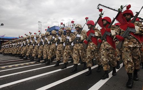 Iranian soldiers march during the Army Day parade in Tehran, Iran, April 18, 2010. Iranian President Mahmoud Ahmadinejad said here on Sunday that the interference of foreigners served the root cause of all tensions and divisions in the region, demanding foreign forces to leave the region. [Xinhua] 