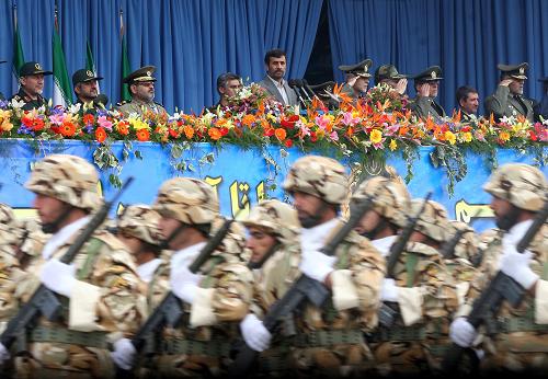 Iranian President Mahmoud Ahmadinejad (C back) reviews the forces during the Army Day celebration in Tehran, Iran, April 18, 2010. Mahmoud Ahmadinejad said here on Sunday that the interference of foreigners served the root cause of all tensions and divisions in the region, demanding foreign forces to leave the region. [Xinhua] 