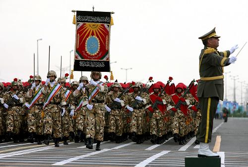 Iranian soldiers march during the Army Day parade in Tehran, Iran, April 18, 2010. Iranian President Mahmoud Ahmadinejad said here on Sunday that the interference of foreigners served the root cause of all tensions and divisions in the region, demanding foreign forces to leave the region. [Xinhua] 