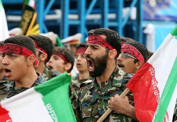  Iranian soldiers march during the Army Day parade in Tehran, Iran, April 18, 2010. Iranian President Mahmoud Ahmadinejad said here on Sunday that the interference of foreigners served the root cause of all tensions and divisions in the region, demanding foreign forces to leave the region. [Xinhua] 