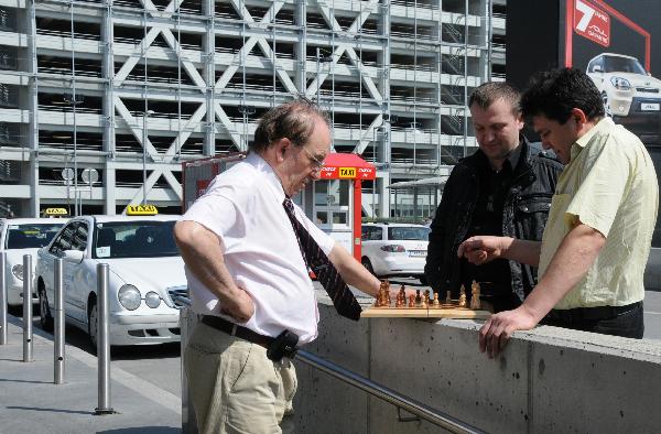Taxi drivers play the chess as flights restriction continues at Vienna International Airport in Vienna, Austria, April 17, 2010. (Xinhua/Liu Gang)