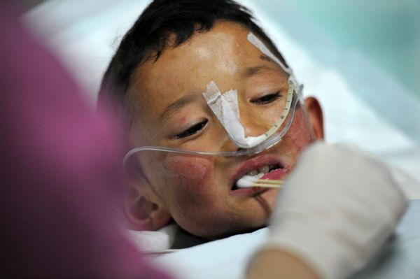 Injured boy Gajiao receives medical treatment at the Huaxi Hospital Affiliated to Sichuan University in Chengdu, southwest China's Sichuan Province, April 18, 2010. 