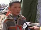 Boy volunteer in quake zone 