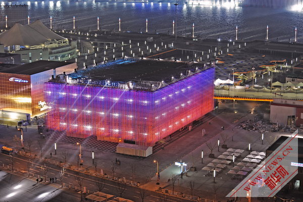 Photo taken on April 17, 2010 shows a group of permanent pavilions irradiated by the nearby music water curtain in a trial operation at the Shanghai EXPO park in Shanghai, China. [Xinhua]