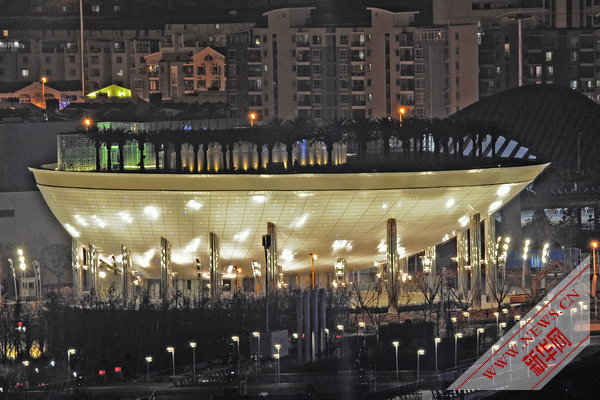 Photo taken on April 17, 2010 shows a group of permanent pavilions irradiated by the nearby music water curtain in a trial operation at the Shanghai EXPO park in Shanghai, China. [Xinhua]