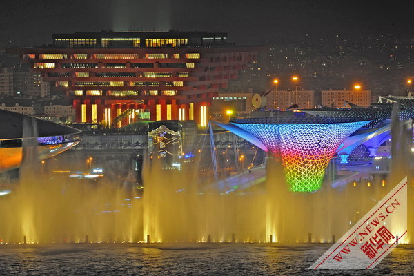 Photo taken on April 17, 2010 shows a group of permanent pavilions irradiated by the nearby music water curtain in a trial operation at the Shanghai EXPO park in Shanghai, China. [Xinhua]