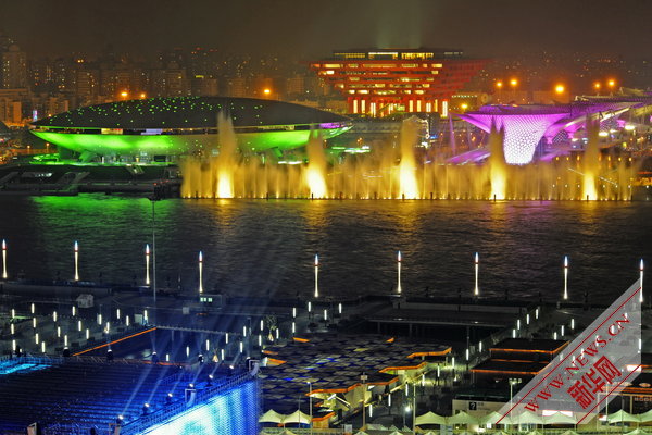 Photo taken on April 17, 2010 shows a group of permanent pavilions irradiated by the nearby music water curtain in a trial operation at the Shanghai EXPO park in Shanghai, China. [Xinhua]