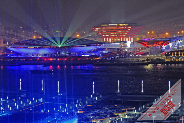 Photo taken on April 17, 2010 shows a group of permanent pavilions irradiated by the nearby music water curtain in a trial operation at the Shanghai EXPO park in Shanghai, China. [Xinhua]