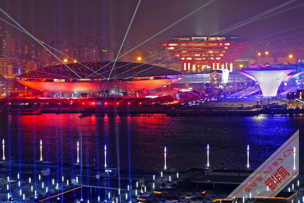 Photo taken on April 17, 2010 shows a group of permanent pavilions irradiated by the nearby music water curtain in a trial operation at the Shanghai EXPO park in Shanghai, China. [Xinhua]