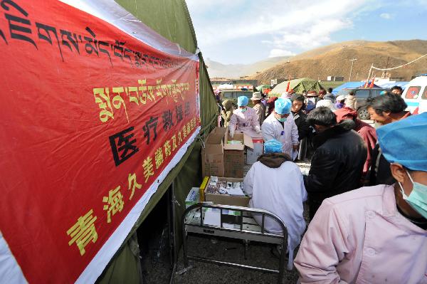Local residents wait to receive treatment at a spot of a Tibetan medicine hospital in the quake-hit Yushu Tibetan Autonomous Prefecture of northwest China's Qinghai Province, April 19, 2010. 