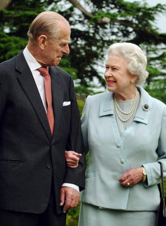 Britain&apos;s Queen Elizabeth II and the Duke of Edinburgh pose for photographs in the grounds of Broadlands, southern England earlier this year in this photo made available Sunday Nov. 18, 2007. Broadlands is the home of the Duke&apos;s uncle, Earl Mountbatten, where the couple spent part of their honeymoon, in November 1947. Buckingham Palace released official photographs Sunday to mark the diamond wedding anniversary of Queen Elizabeth II and her husband, Prince Philip. Elizabeth, who has reigned since the death of her father King George VI in 1952, is the first British monarch to celebrate a diamond wedding anniversary. She was 21-year-old Princess Elizabeth when she married young naval officer Lt. Philip Mountbatten, 26, at Westminster Abbey on Nov. 20, 1947. 