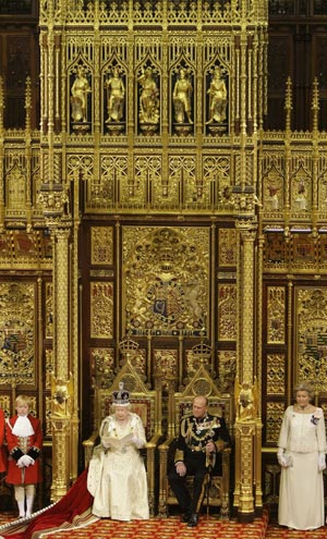 Britain&apos;s Queen Elizabeth delivers her speech as she sits with Prince Philip during the State Opening of Parliament, in the House of Lords within the Palace of Westminster, London November 18, 2009. (Xinhua/Reuters Photo)