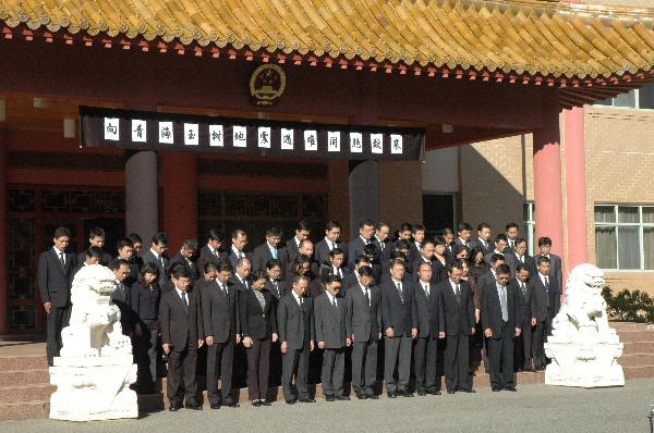 Staff members of the Chinese Embassy to Australia attend a mourning ceremony in honor of victims of the earthquake that hit Yushu County of northwest China's Qinghai Province, in Canberra, capital of Australia, April 21, 2010. A national day of mourning for the quake victims is held across China and its embassies and consulates overseas starting from 0:00 o'clock Wednesday Beijing local time. 