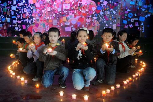 People across China light candles to mourn the Yushu earthquake dead and pray for the affected. 