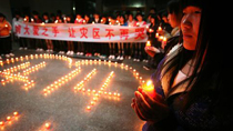 Chinese light candles to mourn Yushu quake victims