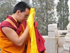 The 11th Panchen Lama prays for quake victims