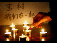 People across China light candles to mourn the Yushu earthquake dead and pray for the affected. [Xinhua]