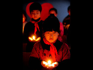 People across China light candles to mourn the Yushu earthquake dead and pray for the affected. [Xinhua]