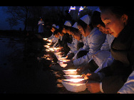 People across China light candles to mourn the Yushu earthquake dead and pray for the affected. [Xinhua]