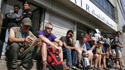 European passengers stranded in Nepal queue for tickets