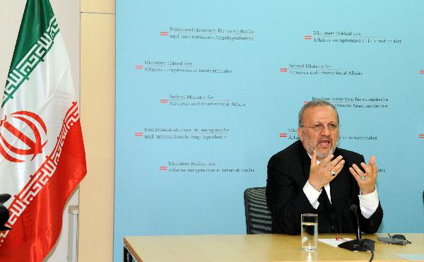 Iranian Foreign Minister Manouchehr Mottaki speaks during a joint press conference with his Austrian counterpart Michael Spindelegger (not pictured) in Vienna April 25, 2010. [Liu Gang/Xinhua] 