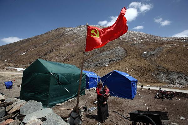 A herdman stands at tent area in the quake-hit Tibetan Autonomous Prefecture of Yushu, northwest China's Qinghai Province, April 22, 2010