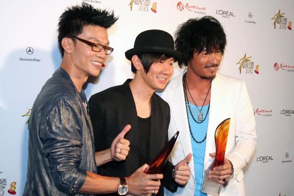 Singer JJ Lam (C), Christopher Lee (R) and Mark Lee pose during the Star Awards 2010 held in Singapore, April 25, 2010. 