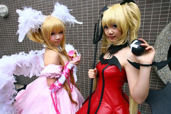 Two cosplay fans put on poses of cartoon figures during the two-day Asian Cosplay Innovative Creation Exhibition in Taipei, Taiwan, April 24, 2010. More than 1,000 cosplay fans took part in the exhibition.