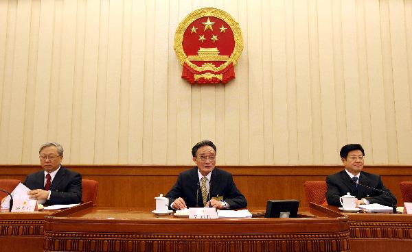 Wu Bangguo (C), chairman of the Standing Committee of the National People's Congress, China's top legislature, addresses the first plenary meeting of the 14th session of the Standing Committee of the 11th National People's Congress (NPC), in Beijing, capital of China, on April 26, 2010. (Xinhua
