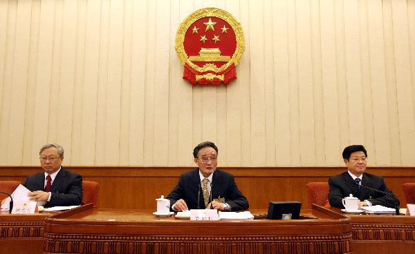 Wu Bangguo (C), chairman of the Standing Committee of the National People's Congress, China's top legislature, addresses the first plenary meeting of the 14th session of the Standing Committee of the 11th National People's Congress (NPC), in Beijing, capital of China, on April 26, 2010. [Xinhua]