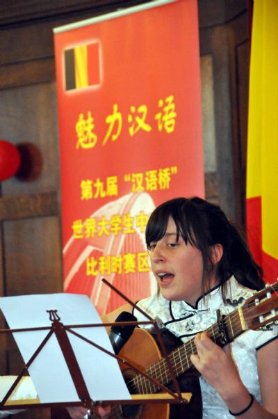 College student Eva Van Boxstael sings a song in Chinese during a preliminary contest of the 9th Chinese Bridge Competition in Brussels, Belgium, April 24, 2010.
