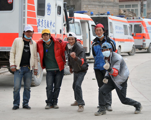Five male volunteers pose for a photo in Yushu, Northwest China's Qinghai province on April 21, 2010.