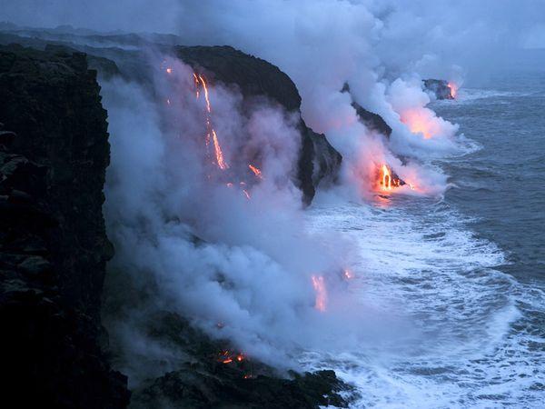 Lava Flowing Into the Pacific with a hiss of steam, lava flows into the Pacific Ocean in Hawaii Volcanoes National Park, Hawaii. The Hawaiian island chain has been built up by similar flows of molten rock over millions of years.[Stephen Alvarez/CNTV]