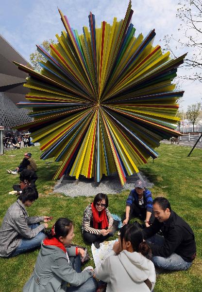 Visitors play poker during the trial operation in Shanghai Expo Park in Shanghai, east China, April 25, 2010. The Shanghai expo conducted trial operations for six times on April 20 - 26. [Xinhua/Wang Song] 