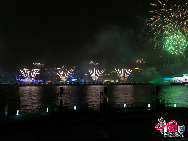 Fireworks explode over the Shanghai World Expo site during a rehearsal for its opening ceremony April 27, 2010. [Photo by Hu Di]