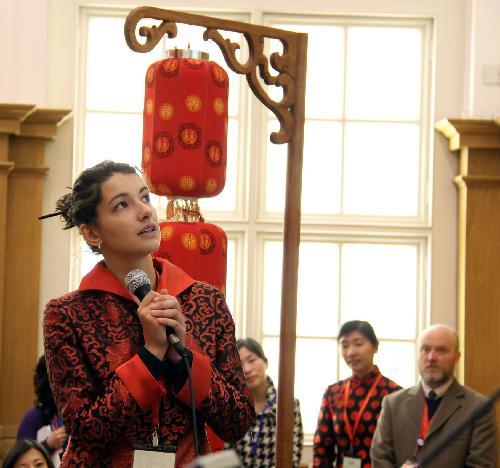 A contestant prepares to answer cultural knowledge questions during the British leg of the ninth 'Chinese Bridge' world university students' Chinese lauguage competition at the London School of Economics in London, capital of Britain, March 13, 2010. [Xinhua]