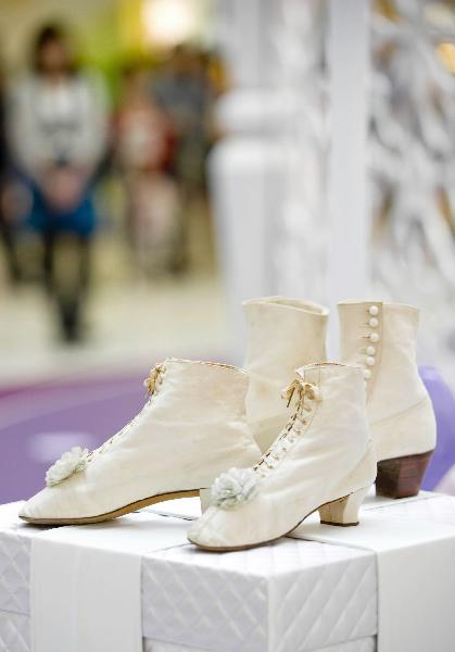 Photo taken on April 27, 2010, shows a pair of wedding shoes made in 1867 in Canada. An antique shoes show was held in Hong Kong, on April 27, 2010. 