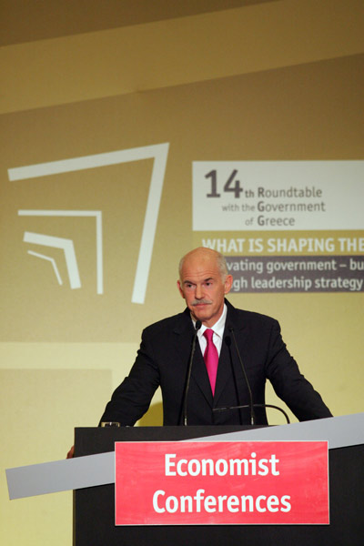 Greek Prime Minister George Papandreou speaks at the 14th Roundtable with the Greek Government organized by the Economist in Athens, capital of Greece, April 28, 2010. Papandreou suggested on Wednesday evening a global financial governance to address the deep economic crisis that now seems to spread from Greece to other Euro-zone member countries. [Marios Lolos/Xinhua]