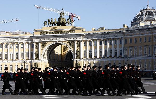 Armed services members march during a rehearsal of a parade marking the 65th anniversary of the victory in the Great Patriotic War, as the then Soviet Union and now Russia have called that phase of World War II. Military parades are planned to be held in 18 cities across Russia on May 9, the 65th Victory Day. [Lu Jinbo/Xinhua]