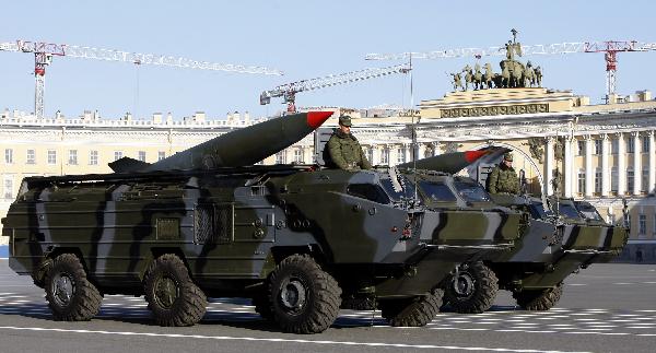 Armed services members march during a rehearsal of a parade marking the 65th anniversary of the victory in the Great Patriotic War, as the then Soviet Union and now Russia have called that phase of World War II. [Lu Jinbo/Xinhua]