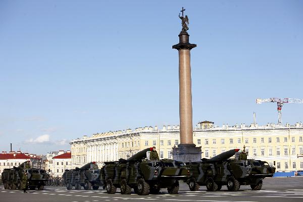 Armed services members march during a rehearsal of a parade marking the 65th anniversary of the victory in the Great Patriotic War, as the then Soviet Union and now Russia have called that phase of World War II. [Lu Jinbo/Xinhua]