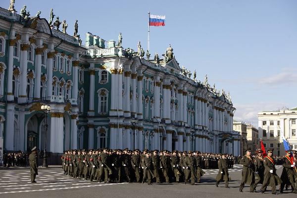 Armed services members march during a rehearsal of a parade marking the 65th anniversary of the victory in the Great Patriotic War, as the then Soviet Union and now Russia have called that phase of World War II. [Lu Jinbo/Xinhua]