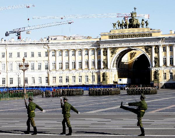 Armed services members march during a rehearsal of a parade marking the 65th anniversary of the victory in the Great Patriotic War, as the then Soviet Union and now Russia have called that phase of World War II. [Lu Jinbo/Xinhua]