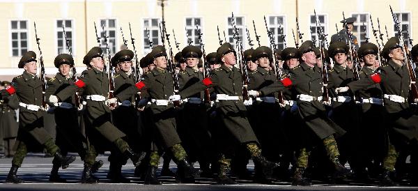 Armed services members march during a rehearsal of a parade marking the 65th anniversary of the victory in the Great Patriotic War, as the then Soviet Union and now Russia have called that phase of World War II. [Lu Jinbo/Xinhua]