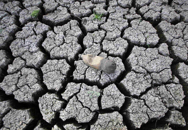 A plastic bottle rests on cracked earth at Las Canoas Lake, 59 km (37 mi) north of the capital Managua, Nicaragua on April 20, 2010. The water level of the lake has fallen to dangerously low levels due to a severe drought.