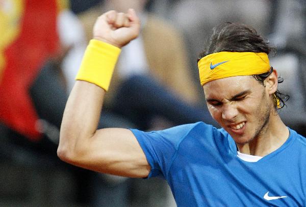 Rafael Nadal of Spain reacts after beating Stanislas Wawrinka of Switzerland during their quarter final match at the Rome Masters tennis tournament in Rome April 30, 2010. [Xinhua]