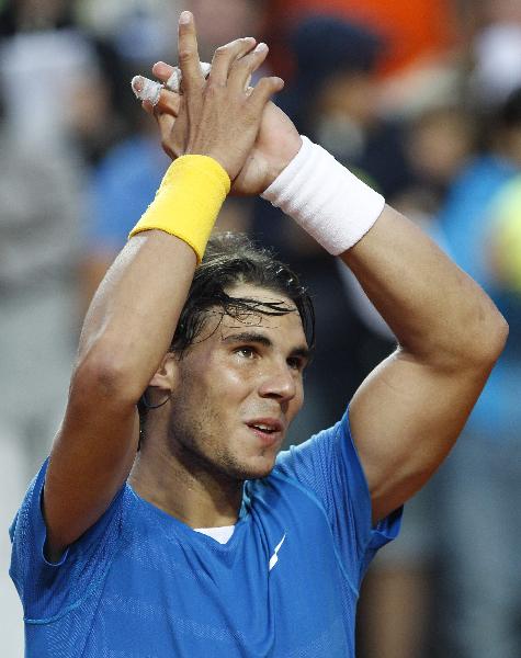 Rafael Nadal of Spain reacts after beating Stanislas Wawrinka of Switzerland during their quarter final match at the Rome Masters tennis tournament in Rome April 30, 2010. [Xinhua]