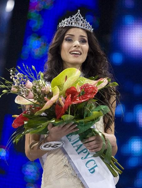 Yakimovich reacts during the awards ceremony after she won the Miss Belarus Beauty Contest 2010 in Minsk, April 30, 2010. (Xinhua/Reuters Photo) 